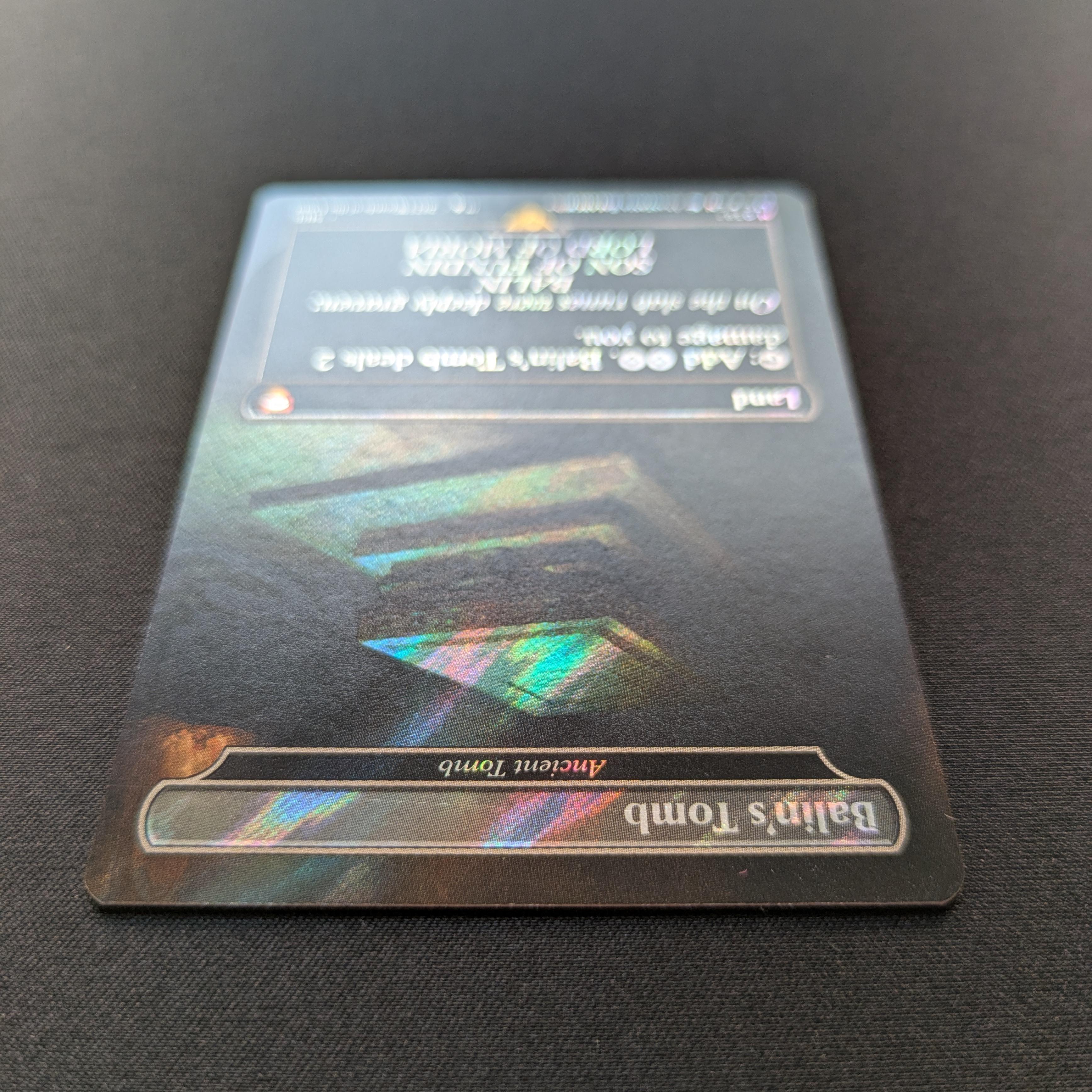 MTG Singles - [FOIL] Ancient Tomb (Surge Foil) - Commander: The Lord of the Rings: Tales of Middle-earth: Extras - NM - 