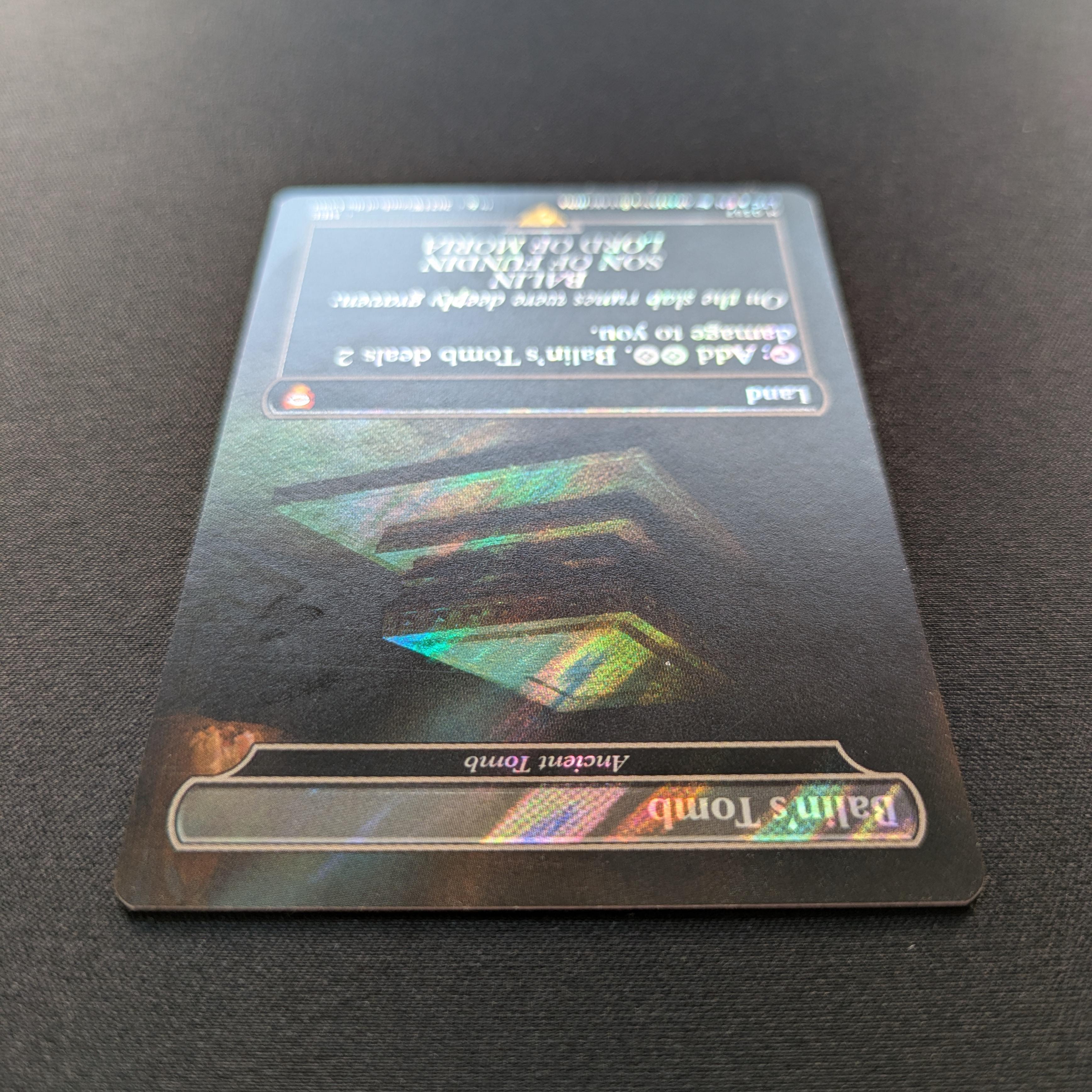 MTG Singles - [FOIL] Ancient Tomb (Surge Foil) - Commander: The Lord of the Rings: Tales of Middle-earth: Extras - NM - 